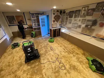 Drying equipment running on a stripped floor during a Williamson County dry-out